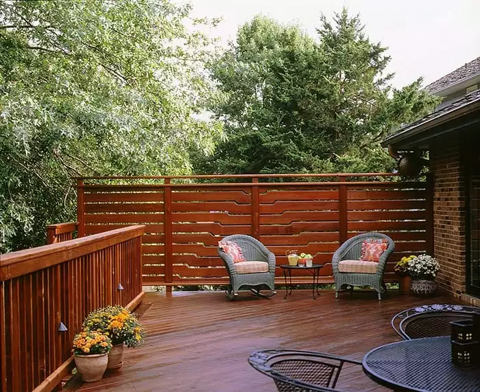 A redwood deck with patio furniture